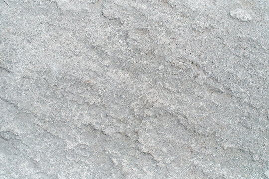Pattern of Seamless rock texture and surface background close up. Rough split face stone texture.