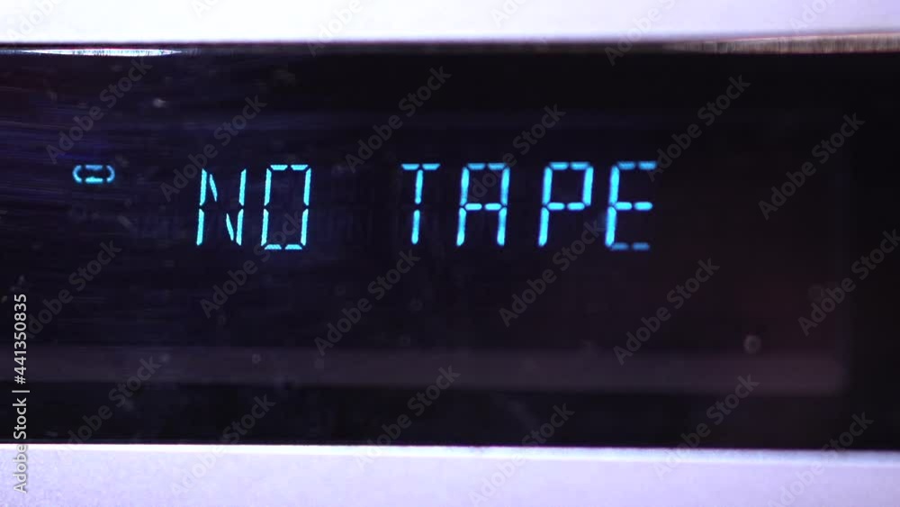 Poster no tape no disc, changing input on audio amplifier, digital display close up