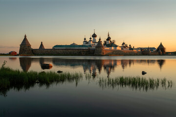View of the Solovetsky Monastery from the side of the Holy Lake on a sunny cloudless morning, Solovetsky Island, Arkhangelsk region, Russia