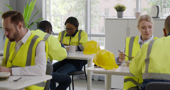 Diverse Factory Workers Having Lunch In Canteen