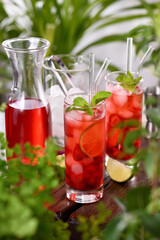 Fototapeta na wymiar Strawberry summer cocktail or lemonade. Refreshing organic soft drink with ripe berries in a glass
