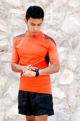 Runner setting up his sports watch to start his run