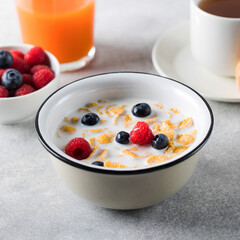 Cornflakes with berries and milk. Dry breakfast.