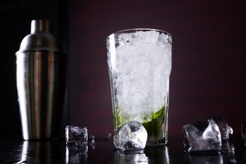 Cocktail on black background. Cocktail at the bar. Alcoholic drink at the night club.