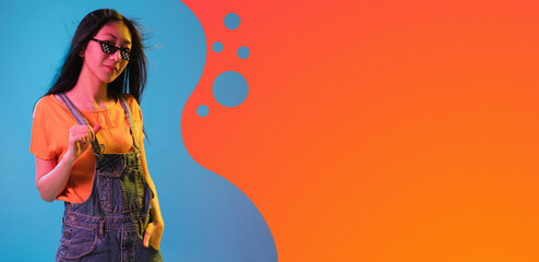 Contemporary art collage, modern design. Retro style. Woman on colored studio background in magazine style. Blue and orange