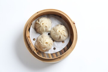 steamed Xiao long bao Shanghai small meat dumpling in bamboo basket with ginger vinegar dim sum menu