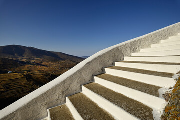 Typical white lime staircase that leads to the top of the chora of the Greek island of Serifos in the Cyclades