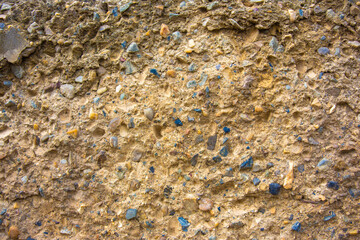  many colored stones in concrete background or texture