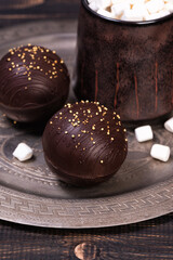Chocolate ball bomb with marshmallows and milk