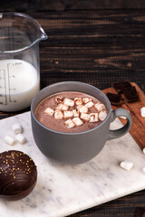 Chocolate ball bomb with marshmallows and milk