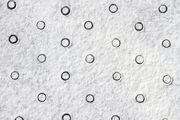 Geometric ornament with dots pattern from white flour sand, powder on table. Natural, organic background for bakery packaging, bread, pasta products. Abstract grainy texture. Minimalist wallpaper.