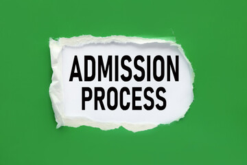 Admission Process - text on white paper near torn green paper