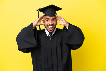 Young university graduate Colombian man isolated on yellow background with surprise expression