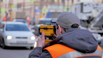 Engineer use tacheometer or theodolite for survey line in city center