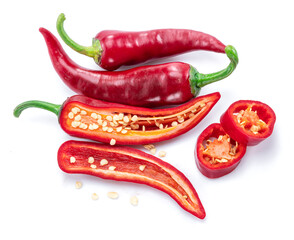 Fresh red chilli pepper and cross section of chilli peppers with seeds isolated on white background.