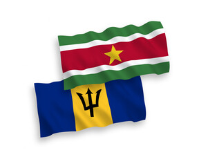 National vector fabric wave flags of Republic of Suriname and Barbados isolated on white background. 1 to 2 proportion.