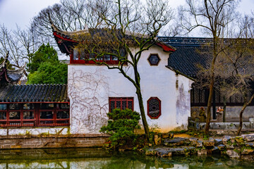 Ancient pavilion chinese architecture building in Suzhou park with white  and red walls