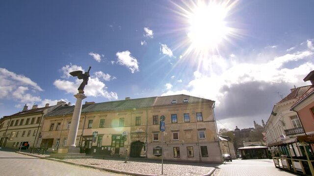 Static footage of empty Uzupis district with its symbol Statue of The Angel against the sun