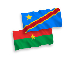 National vector fabric wave flags of Burkina Faso and Democratic Republic of the Congo isolated on white background. 1 to 2 proportion.