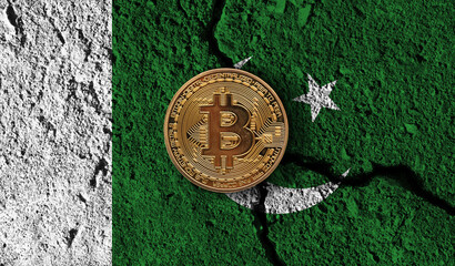 Bitcoin crypto currency coin with cracked Pakistan flag. Crypto restrictions