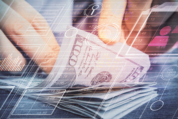 Double exposure of technology drawing hologram and us dollars bills and man hands. Data concept
