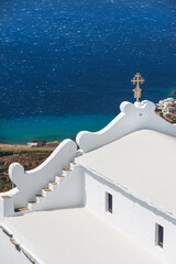 The church of Kioura in the white village of Kardiani overlooking the south coast of the Greek island of Tinos in the Cyclades archipelago