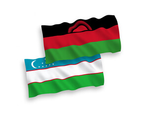 National vector fabric wave flags of Malawi and Uzbekistan isolated on white background. 1 to 2 proportion.