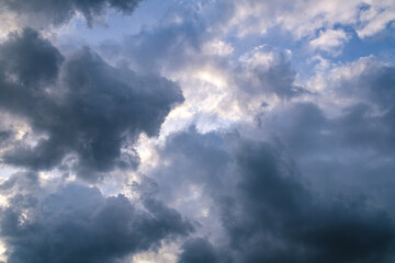 beautiful clouds on sky at sunset over the city in the evening