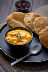 Aam Ras Puri or Alphonso Mango pulp with fried Poori