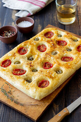 Focaccia with tomatoes and olives. Vegetarian food. Italian food.