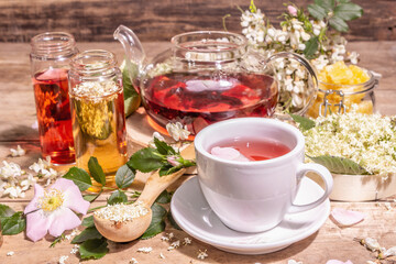 Obraz na płótnie Canvas Assorted tea made from flowers. Fresh elderberry, rose hip, and acacia.
