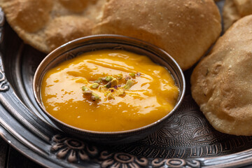 Aam Ras Puri or Alphonso Mango pulp with fried Poori