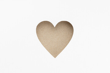 Die-cut Cardboard Heart shaped isolated on white paper background. Love concept