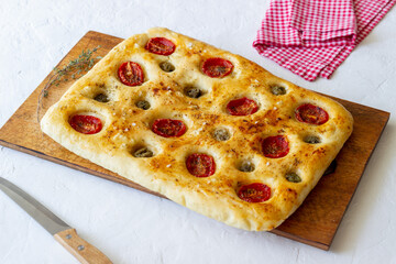 Focaccia with tomatoes and olives. Vegetarian food. Italian food.