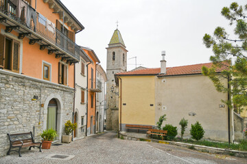 A small street between the old houses of Agnone, a medieval village in the mountains of the Molise region, Italy.