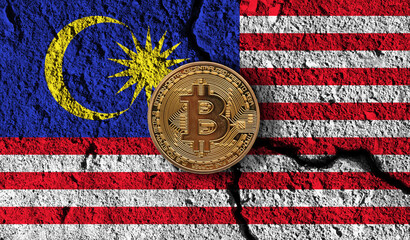 Bitcoin crypto currency coin with cracked Malaysia flag. Crypto restrictions