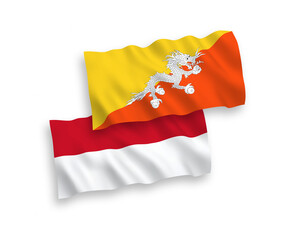 National vector fabric wave flags of Indonesia and Kingdom of Bhutan isolated on white background. 1 to 2 proportion.