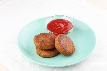 Vegetable cutlets with tomato sauce