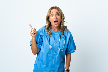 Middle aged surgeon woman over isolated background intending to realizes the solution while lifting a finger up