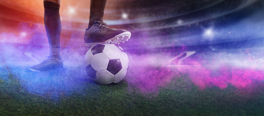 Feet of soccer player step on soccer ball for kick off in stadium