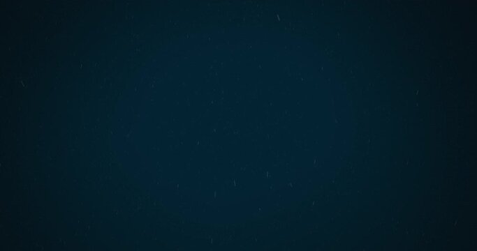 Animation of snow falling in hypnotic motion on dark blue background