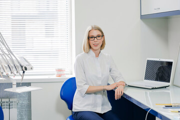 Dentist in a light office. Dental equipment
