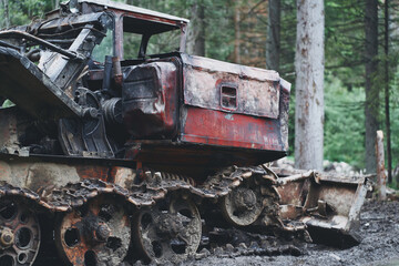 Old rusty abandoned forestry equipment. Ukrainian Carpathian mountains.