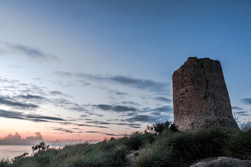 Fototapeta na wymiar An old marine watchtower in El Campello, Alicante, Spain