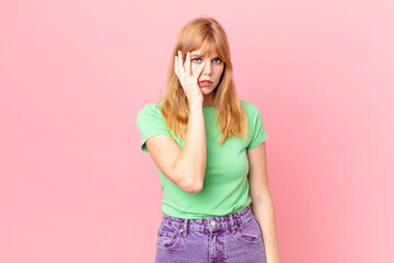 pretty red head woman feeling bored, frustrated and sleepy after a tiresome