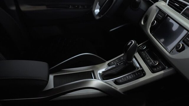 The interior of a luxury car with leather upholstery seats.