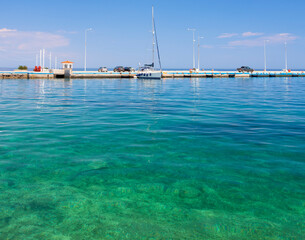 View of the Saronic Gulf and the island Poros from the embankment of the resort town of Methana in...