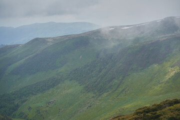 Low clouds and fog over the mountains. Svidovets ridge. Ukraine, Carpathian mountains.