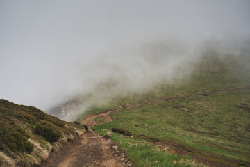 Low clouds and fog over the mountains. Svidovets ridge. Ukraine, Carpathian mountains.