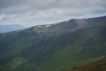Fototapeta premium Low clouds and fog over the mountains. Svidovets ridge. Ukraine, Carpathian mountains.